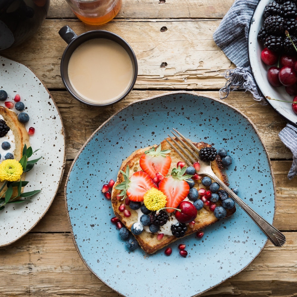 fruit sandwich on a blue ceramic plate